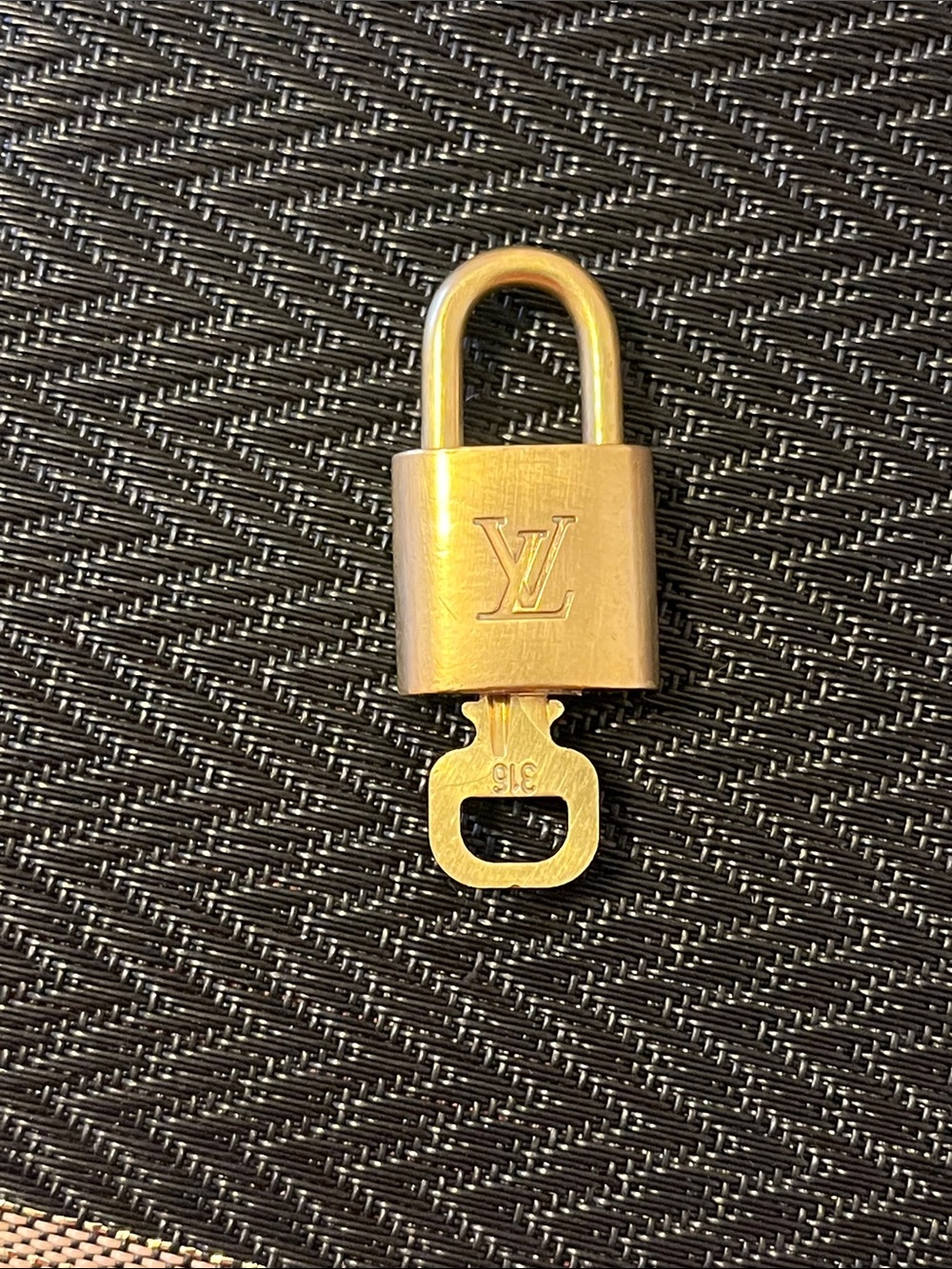 Louis Vuitton Gold Padlock and Key on Black